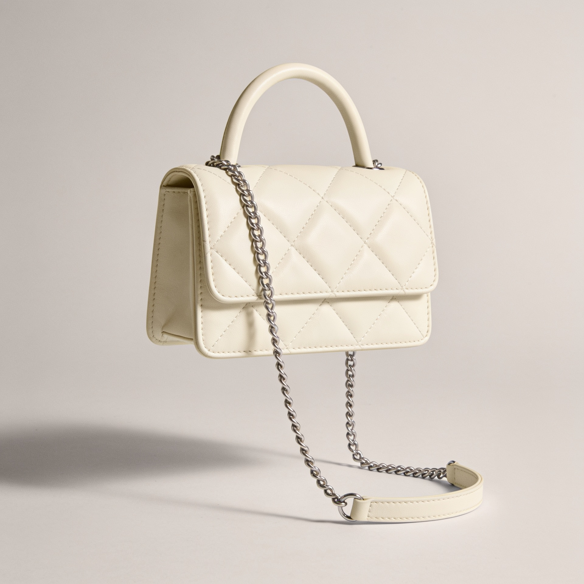 The Quilted Top-Handle in ecru leather