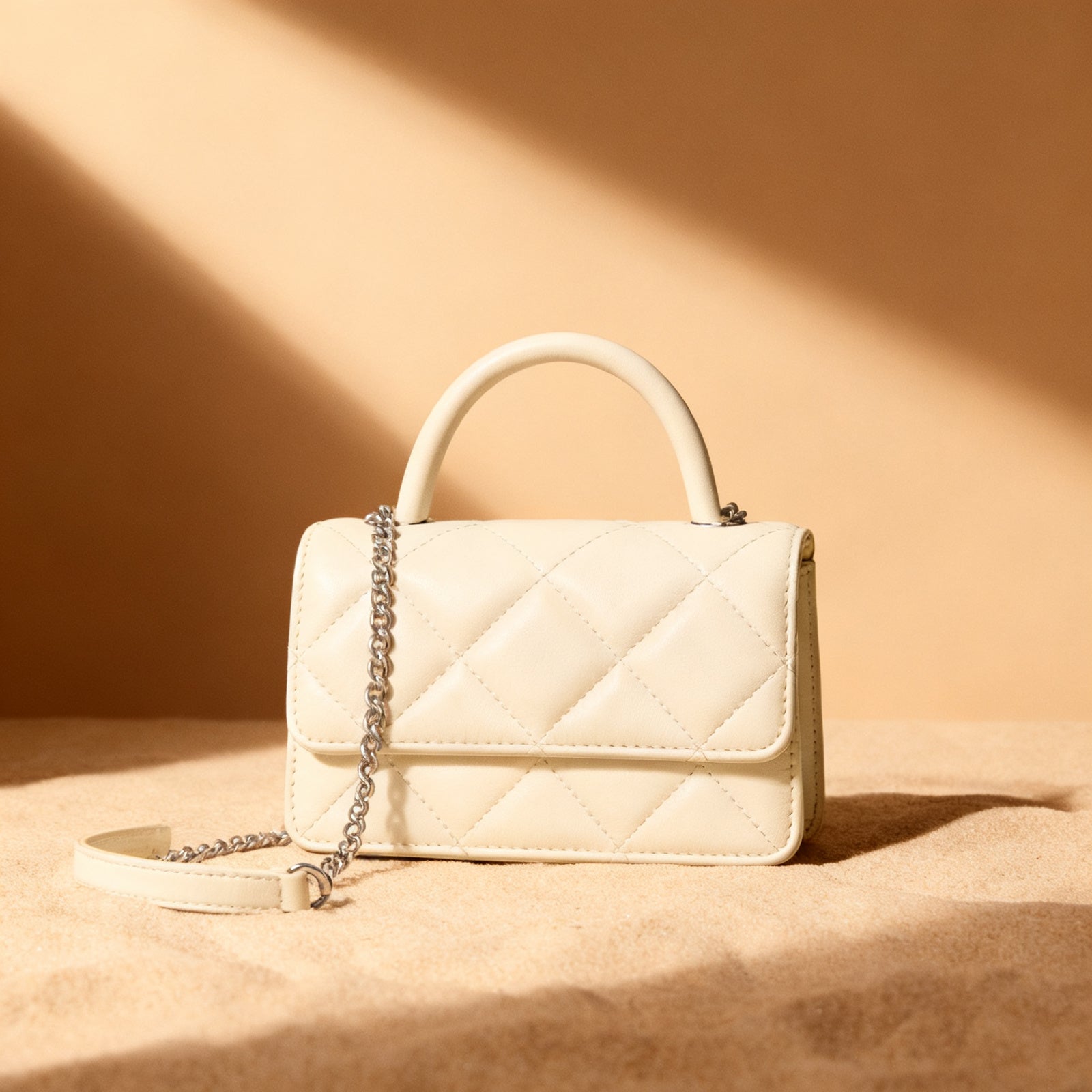 The Quilted Top-Handle in cream exterior, front view