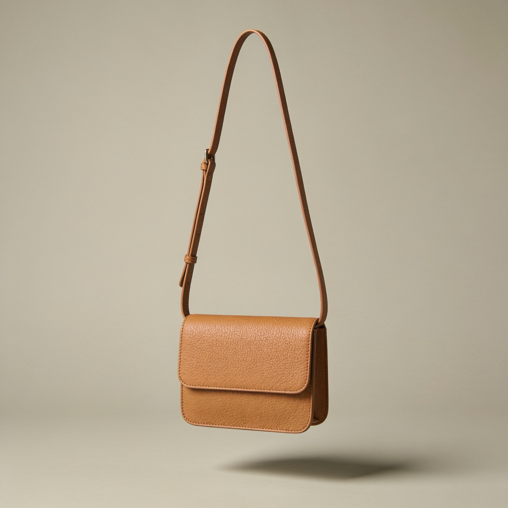 The Crossbody in tan leather