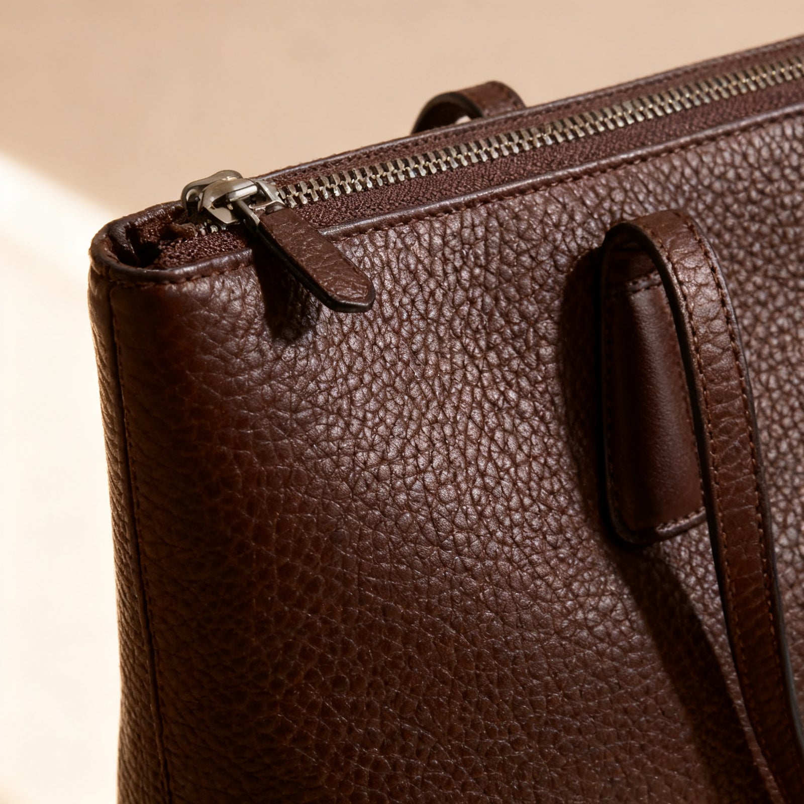 The Zip-Top Tote, leather detail