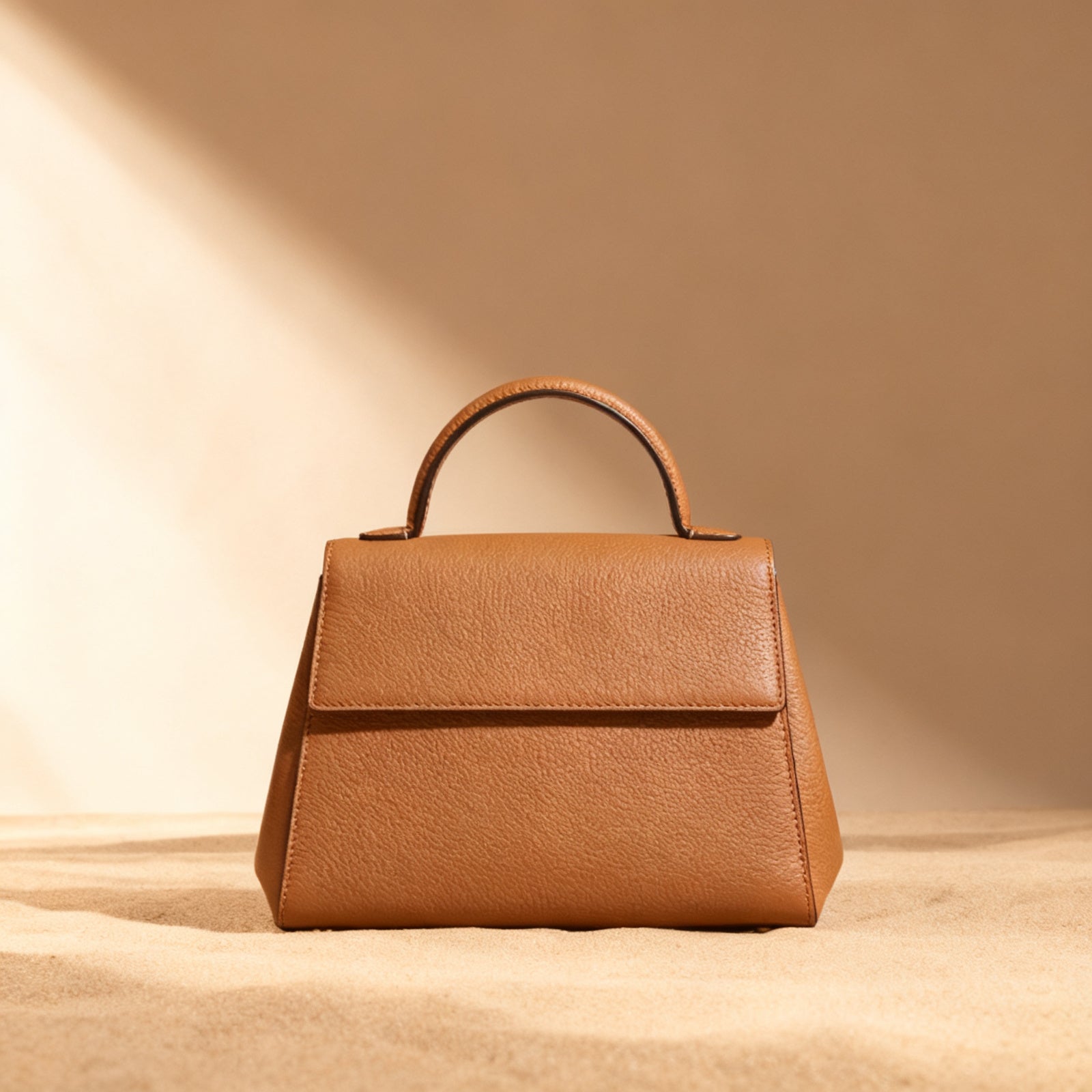 The Structured Satchel in tan exterior, front view