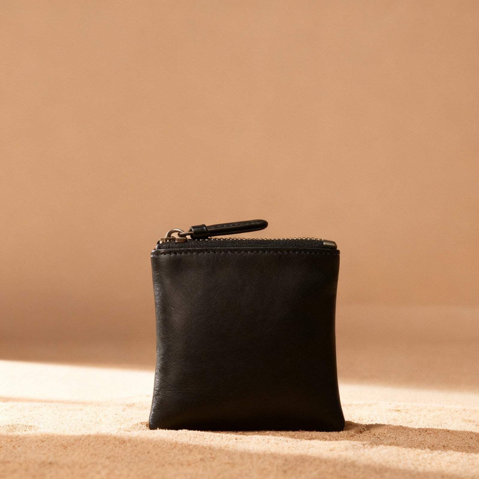 The Zip Pouch in black exterior, front view